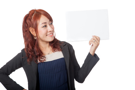 Asian office girl happy look at a blank sign in her hand isolated on white backgroundの写真素材