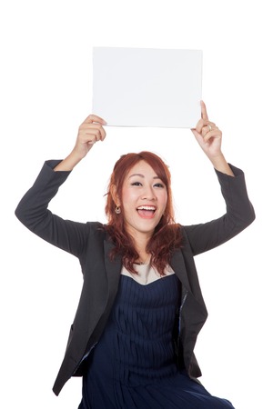 Asian office girl excited show a blank sign over her head isolated on white backgroundの写真素材