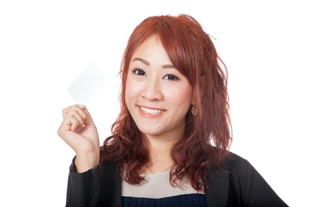 Asian office girl happy show a blank card and smile isolated on white backgroundの写真素材