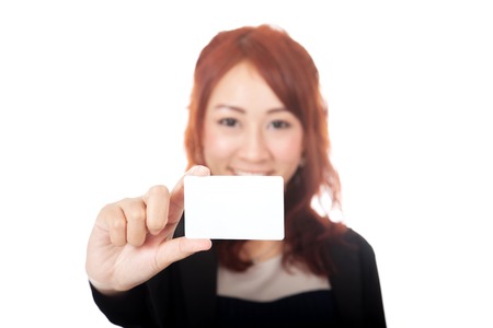 Asian office girl happy show a blank card focus on the card isolated on white backgroundの写真素材