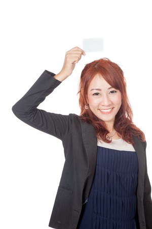Asian office girl happy show blank card over her head isolated on white backgorundの写真素材