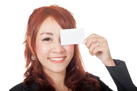 Asian office girl close her eye with a blank card isolated on white backgroundの写真素材