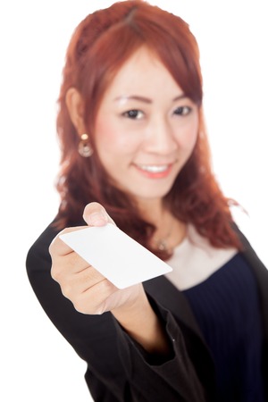 Asian office girl show blank card focus on the card isolated  on white backgroundの写真素材