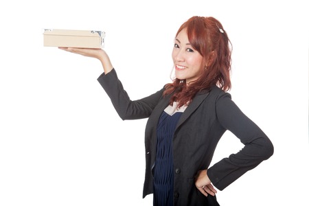 Asian office girl smile show a box on her hand isolated on white backgroundの写真素材