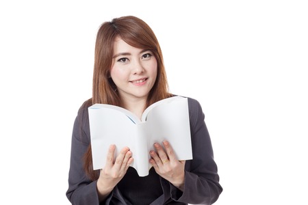 Asian businesswoman is reading  a book and smile isolated on white backgroundの写真素材