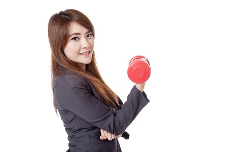 Side of Asian businesswoman happy lift a dumbbell with a hand isolated on white backgroundの写真素材