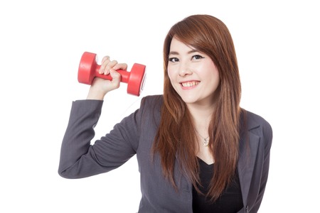 Asian businesswoman happy lift a dumbbell with a hand isolated on white backgroundの写真素材