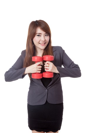 Asian businesswoman smile holding drumbbells together isolated on white backgroundの写真素材