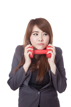 Asian businesswoman not happy to exercise isolated on white の写真素材