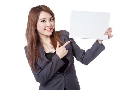 Asian businesswoman  point to a blank sign isolated on white backgroundの写真素材