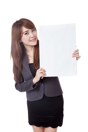Asian businesswoman  show a vertical  blank sign on her left side and smile isolated on white backgroundの写真素材