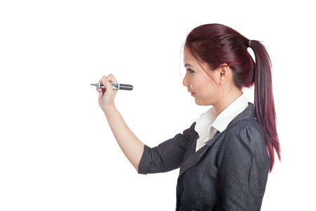 Side view of Asian office girl writing with a pen on air isolated の写真素材
