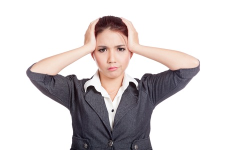 Asian office girl headache put both hand to head isolated の写真素材