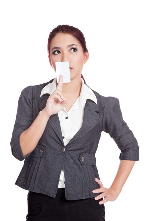 Asian businesswoman show a blank card and think of something isolated の写真素材