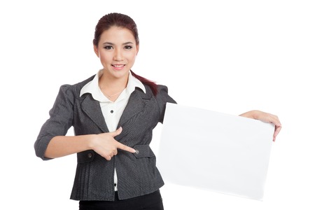 Asian businesswoman point to a blank sign on her hip isolatedの写真素材