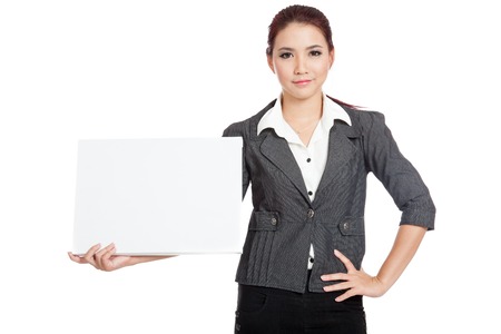 Asian businesswoman hold a blank sign and arms akimbo isolated の写真素材