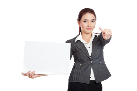 Asian businesswoman show a blank sign point to camera isolated の写真素材