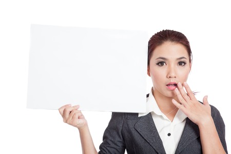Asian businesswoman show a blank sign and surprise isolated の写真素材