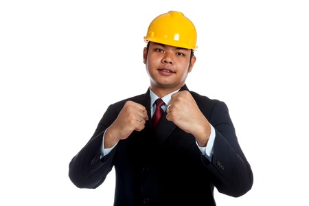 Asian engineer man with his fists rise ready to fight isolated の写真素材