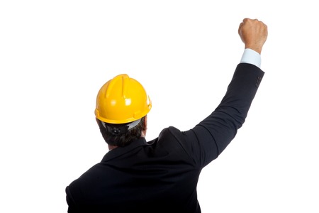 Back of Asian engineer man rise his fist up for success  isolated の写真素材