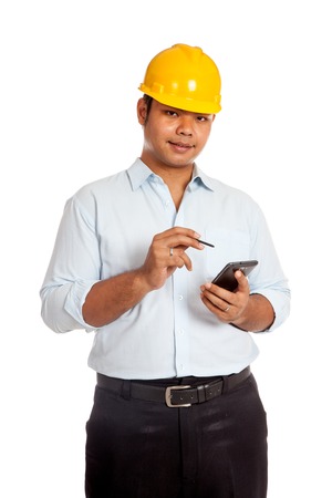 Asian engineer man hold a cellphone and a pen isolated の写真素材