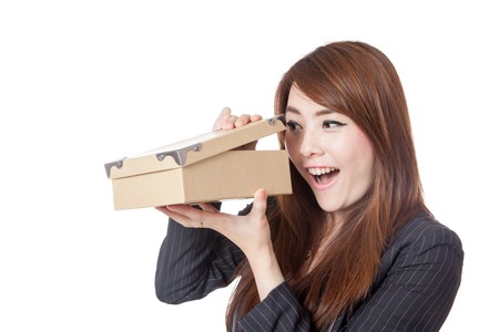 Asian Businesswoman excited look inside the box  isolated on white backgroundの写真素材