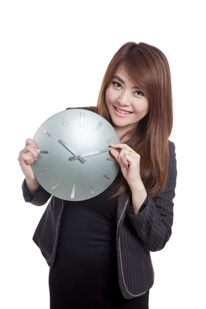 Asian Businesswoman move a clock hand and smile  isolated on white backgroundの写真素材