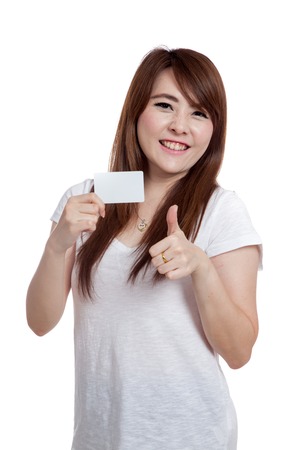 Asian girl show a  blank card and thumbs up  isolated on white backgroundの写真素材