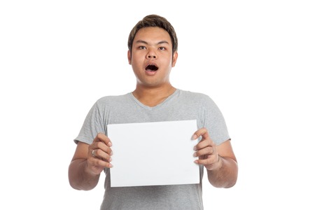Asian strong man  shocked, surprised, with blank sign isolated on white backgroundの写真素材