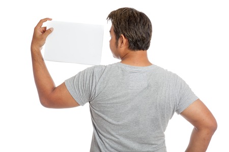 Back of Asian strong man  flexing biceps show blank sign look at the sign isolated on white backgroundの写真素材