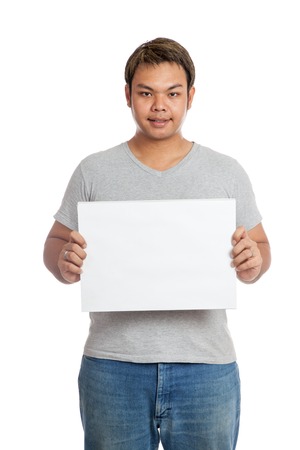 Asian strong man show blank sign look at the camera  isolated on white backgroundの写真素材