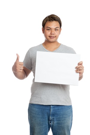 Asian man thumbs up with  blank sign look at the camera  isolated on white backgroundの写真素材