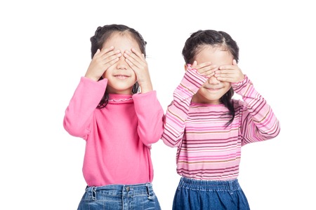 Asian twin sisters close their eyesの写真素材