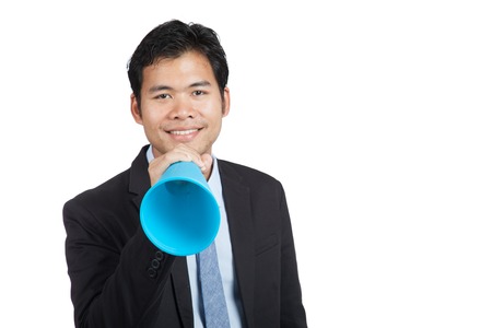 Asian businessman with megaphone isolated on white backgroundの写真素材