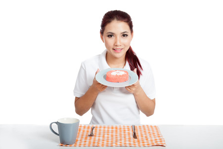 Asian girl show strawberry cake isolated on white backgroundの写真素材