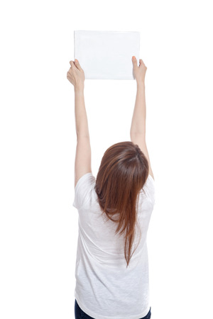 Back of Asian girl hold blank sign with both hands  isolated on white backgroundの写真素材