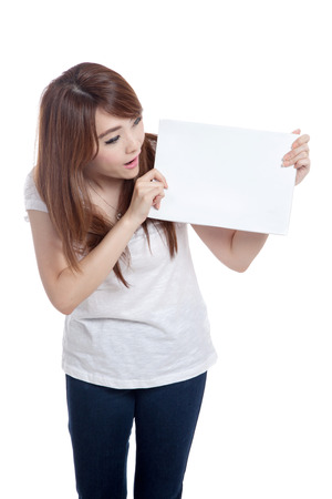 Asian girl look at  blank sign  isolated on white backgroundの写真素材