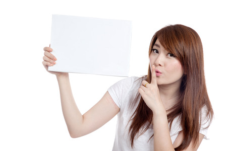 Asian girl hold blank sign and do quite sign  isolated on white backgroundの写真素材