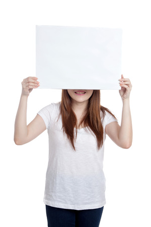 Asian girl hold blank sign close her eyes  isolated on white backgroundの写真素材