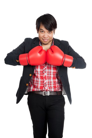 Asian businessman wear boxing gloves ready to fight  isolated on white backgroundの写真素材