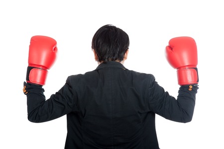Back of Asian businessman wear boxing gloves  isolated on white backgroundの写真素材