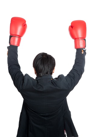 Asian man wear boxing gloves raise his hands up  isolated on white backgroundの写真素材