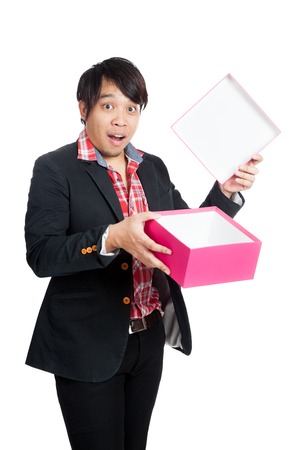 Asian man surprise open a blank gift box isolated on white backgroundの写真素材