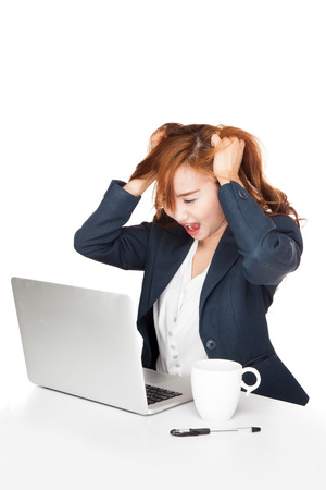 Frustration Asian office girl look at PC  isolated on white backgroundの写真素材