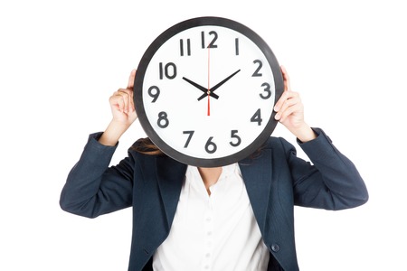 Close up Asian businesswoman with clock on face  isolated on white backgroundの写真素材