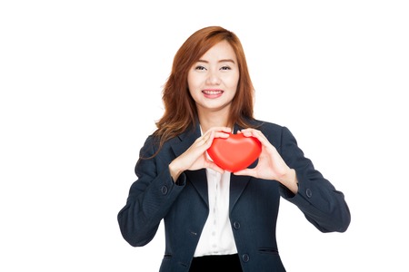 Asian businesswoman show a red heart  isolated on white backgroundの写真素材