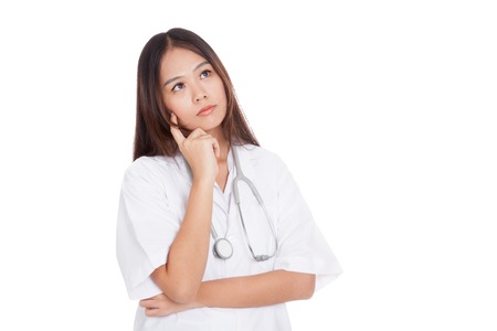 Portrait of Asian young female doctor thinking  isolated on white backgroundの写真素材