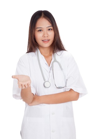 Asian young female doctor smile show her hand  isolated on white backgroundの写真素材