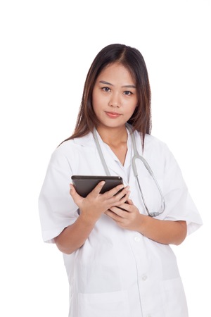 Asian young female doctor with a tablet pc  isolated on white backgroundの写真素材