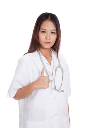 Asian young female doctor show thumbs up  isolated on white backgroundの写真素材